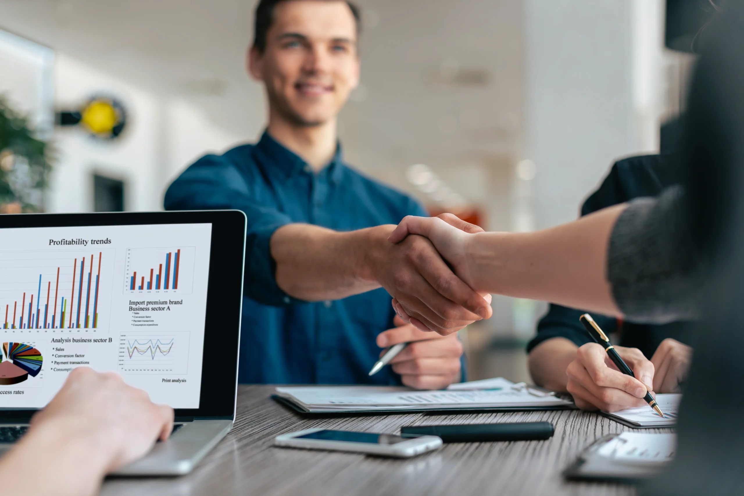 close-up-young-people-greeting-each-other-work-table